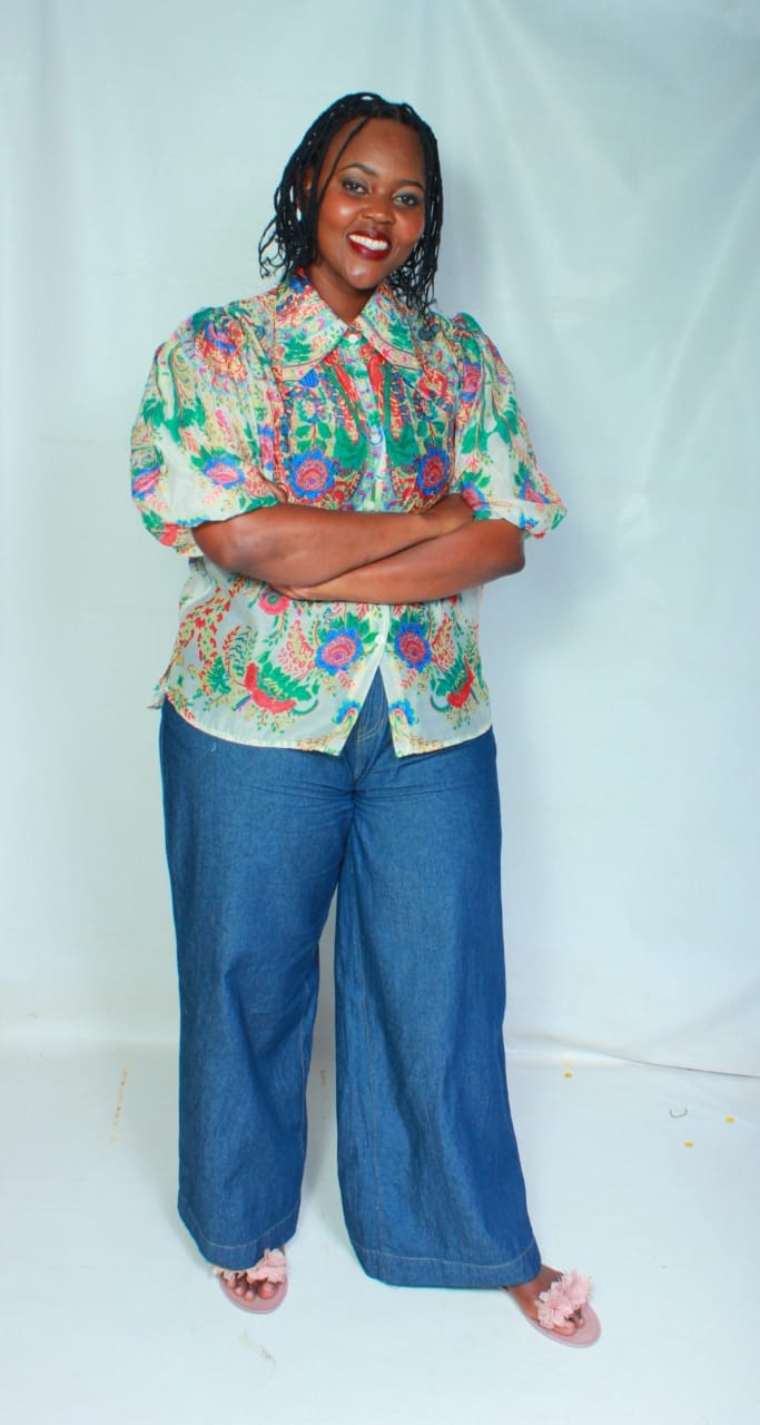 ThuliGlad in a floral blouse