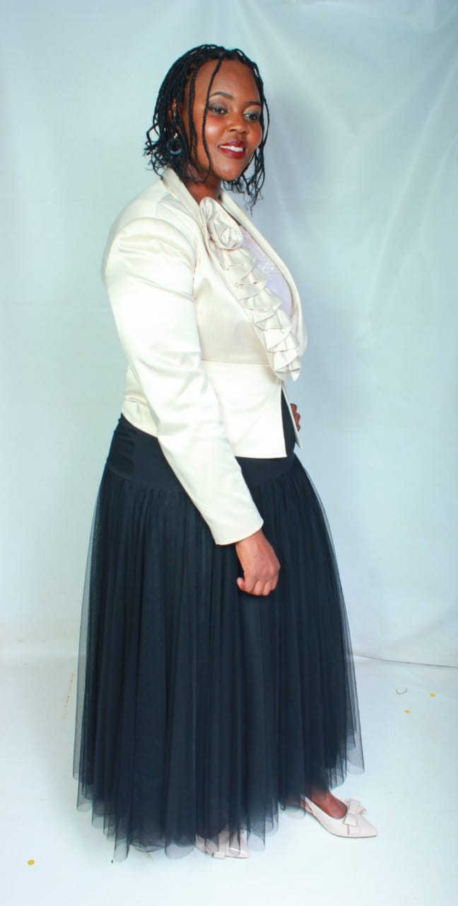 ThuliGlad in ivory blouse and black tulle